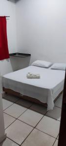 Rúm í herbergi á Hotel Marambaia Ponta Porã