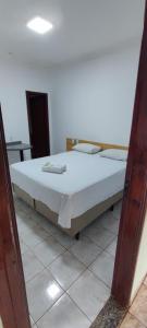 Rúm í herbergi á Hotel Marambaia Ponta Porã