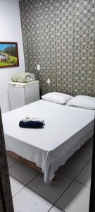 Rúm í herbergi á Hotel Marambaia Ponta Porã