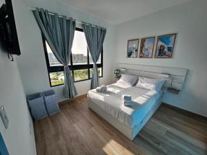 Ένα ή περισσότερα κρεβάτια σε δωμάτιο στο SantoriniRD