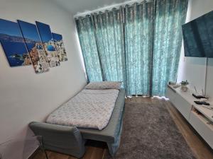 Ένα ή περισσότερα κρεβάτια σε δωμάτιο στο SantoriniRD