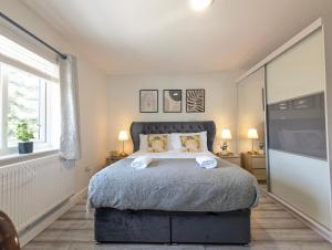 a bedroom with a large bed and a window at Manchester Double Room Near Parks Free Parking in Broadheath