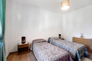 Postel nebo postele na pokoji v ubytování Chez Sabrina