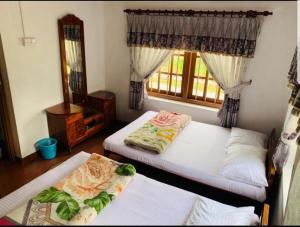 Uma cama ou camas num quarto em Acme Divine View
