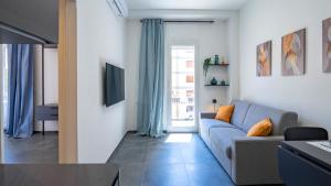 a living room with a couch and a window at EasyTopStay - Gelsomino Charming Flat in Rome