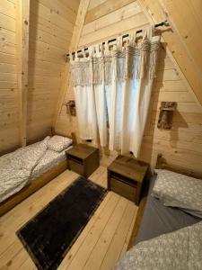 Postel nebo postele na pokoji v ubytování Ethno Village Long Story