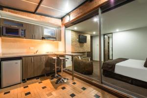 Postel nebo postele na pokoji v ubytování Hotel Apartamentos Regency La Feria