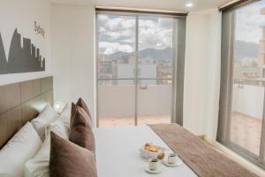 Postel nebo postele na pokoji v ubytování Hotel Apartamentos Regency La Feria