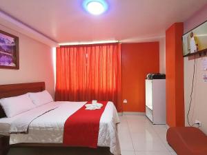 Postel nebo postele na pokoji v ubytování Hostal Flor de los Angeles Salcedo
