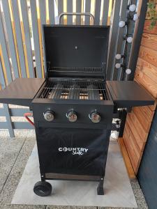 a bbq on a grill on a patio at Mobile Home L&L in Drage