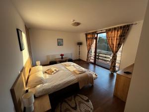 Postel nebo postele na pokoji v ubytování The White House Sohodol