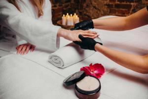 a bride and groom are getting their wedding dressitized at Hotel Zamek Lubliniec in Lubliniec
