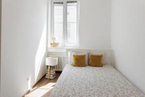 En eller flere senge i et værelse på Boutique Flat in Old Town