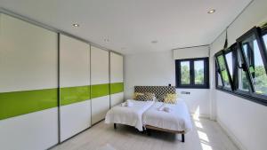 Ένα ή περισσότερα κρεβάτια σε δωμάτιο στο Vivienda Vacacional La Talima +42 φωτογραφίες