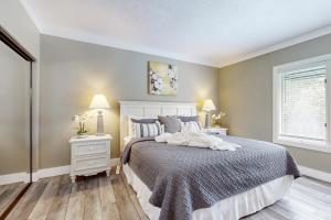 a bedroom with a white bed and two night stands at Anchorage 7473 in Hilton Head Island +16 photos