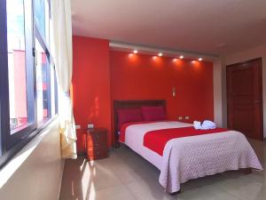 Postel nebo postele na pokoji v ubytování Hostal Flor de los Angeles Salcedo