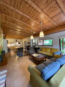 a large living room with couches and a table at Apartamentos Playa Galizano in Galizano