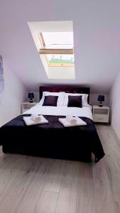 Katil atau katil-katil dalam bilik di Apartamenty Chęciny