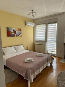 Postel nebo postele na pokoji v ubytování Angellina Apartmani
