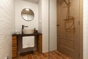 a bathroom with a shower and a glass door at Casas Miguel Bombarda in Castelo de Vide +11 photos