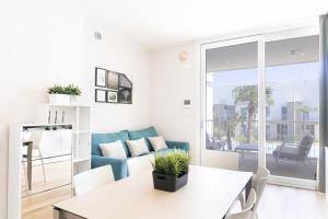 a living room with a couch and a table at Casa Eolo Mare e Relax in Lido di Jesolo