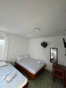 Postel nebo postele na pokoji v ubytování Hotel Melemar