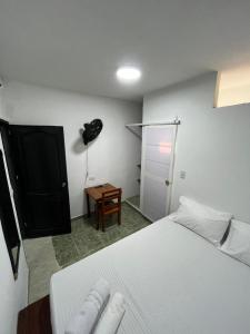 Postel nebo postele na pokoji v ubytování Hotel Melemar