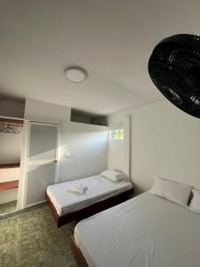 Postel nebo postele na pokoji v ubytování Hotel Melemar + 10 fotografií