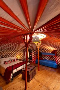 a bedroom with a bed in a yurt at Yurte in Langa in Bosia