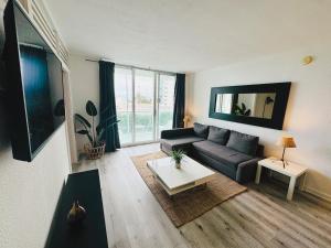 a living room with a couch and a table at Miami Hollywood Condo With Pool and Partial Ocean View 003-21mar in Hollywood