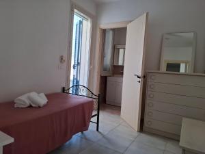 Letto o letti in una camera di 058 Spiaggia di SalentoInVacanza.Com