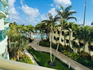 a view of the pool from the balcony of a resort at Miami Hollywood Condo With Pool and Partial Ocean View 003-21mar in Hollywood