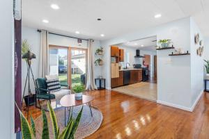 a living room with a couch and a table at AC Beach Farmhouse Retreat - 5BD 2BA in Atlantic City +25 photos