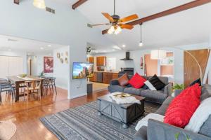 a living room with a couch and a table at AC Beach Farmhouse Retreat - 5BD 2BA in Atlantic City