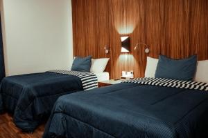 Postel nebo postele na pokoji v ubytování Sky Inn Hotel - Cancun