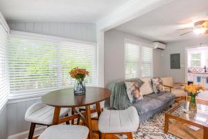 a living room with a couch and a table at Jacksonville Apartment with Private Patio Near NAS! in Jacksonville +16 photos