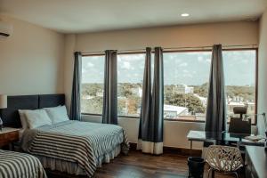 Postel nebo postele na pokoji v ubytování Sky Inn Hotel - Cancun