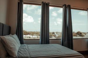 Postel nebo postele na pokoji v ubytování Sky Inn Hotel - Cancun