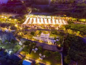 an overhead view of a building with umbrellas at night at Hotel Costa Diva in Praiano