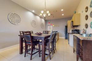 a kitchen with a dining room table and chairs at La Isla Condominiums #C105 in South Padre Island