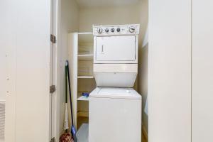 a kitchen with a washer and dryer in a room at La Isla Condominiums #C105 in South Padre Island +16 photos