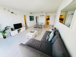 a living room with a couch and a table at Miami Hollywood High Rise Condo 004-22bvic in Hollywood