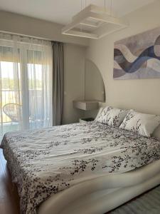 Ένα ή περισσότερα κρεβάτια σε δωμάτιο στο Trajkovski apartments