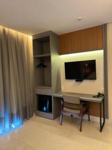 TV a/nebo společenská místnost v ubytování Oásis Hotel + 14 fotografií