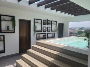 a villa with a swimming pool in a house at Luxury Apartment Downtown in Santiago de los Caballeros