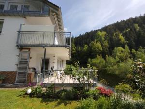 a house on a hill with a balcony at Ferienwohnung Gaby Lehmann in Hornberg
