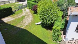 an aerial view of a yard with a bench in the grass at Casa Giulia in Calalzo