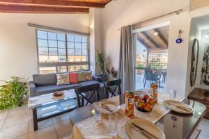 a living room with a couch and a table at Evelina 5 in Lixouri