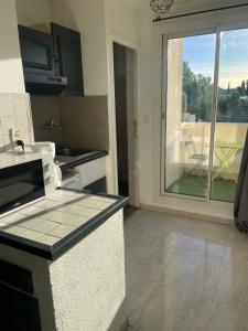 O bucătărie sau chicinetă la Montpellier : Jolie studio très calme