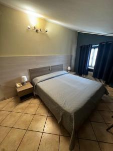 Postel nebo postele na pokoji v ubytování Albergo Carla